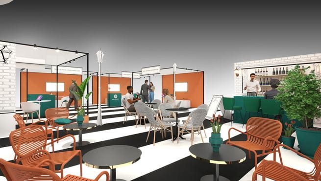 Stand d'exposition intitulé 'Villes et Territoires' avec un aménagement moderne, des tons orange et vert.