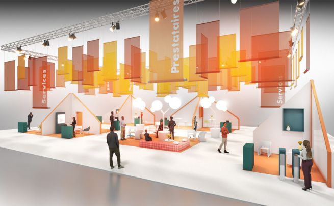 The Service Provider Village exhibition stand with colourful hanging panels, meeting areas and visitors chatting in a modern, open environment.